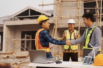 Team of engineer and worker checking construction site outdoors Surveyor builder Engineer surveying...