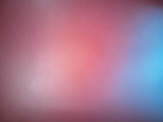 A close up of a red and blue background with a blurry background.