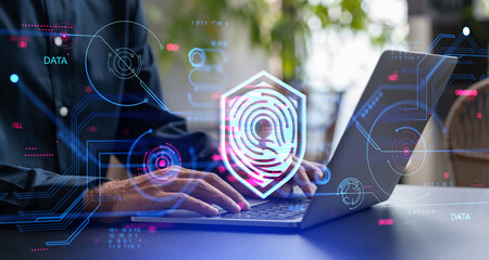 Businessman with laptop, biometric scanning and dashboard with data protection