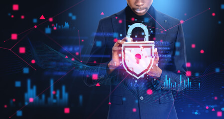 African businessman with digital device, glowing padlock with ab