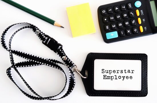 worker staff id card with text written superstar employee on white background. concept of excellent or outstanding talented employee, top performer who inspire colleagues to dream bigger and work hard
