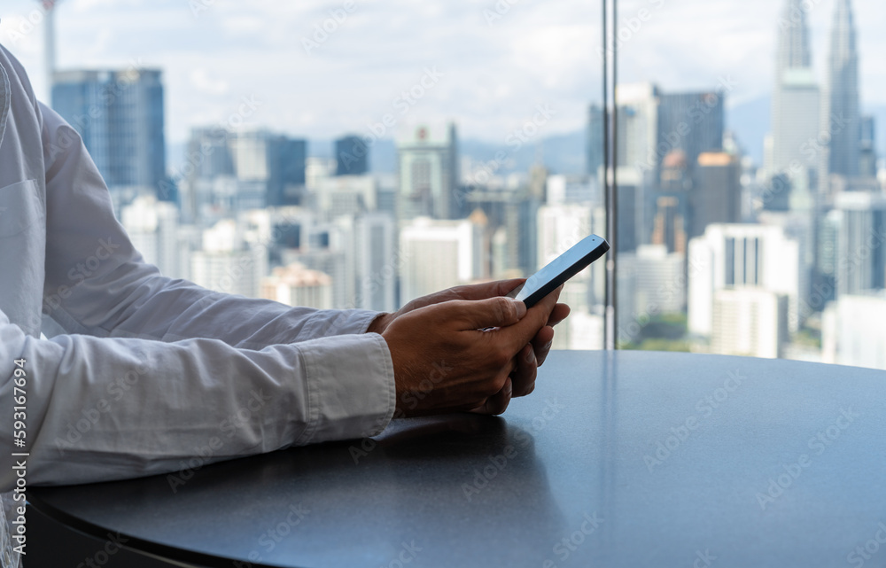 Poster man hands using mobile phone at office table