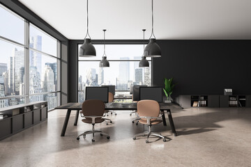 Grey coworking interior with pc computer on a shared desk and sideboard, window