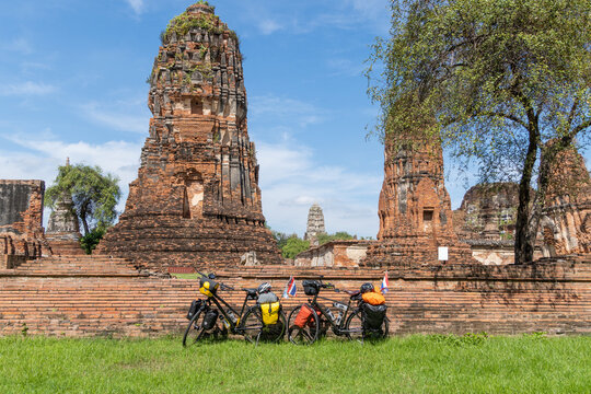 two touring bikes loaded with bags at Bueng Phra Ram Park temple
