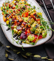 Grilled fresh vegetables in soy sauce on plate
