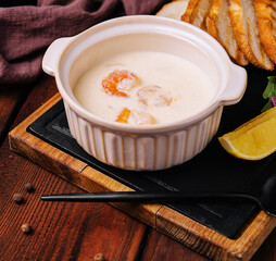 Tasty cream soup with shrimp in bowl
