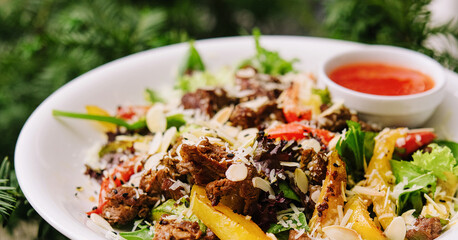 Salad with warm veal and vegetables