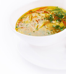 Chicken soup or broth with noodles, herbs and hot green pepper