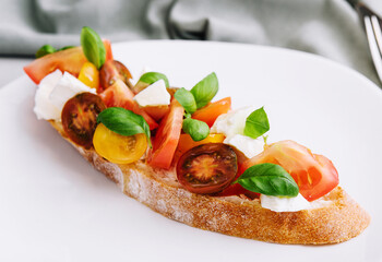 Bruschetta with tomatoes, mozzarella cheese and basil
