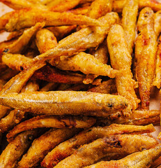 Dried small salted fish heap close up