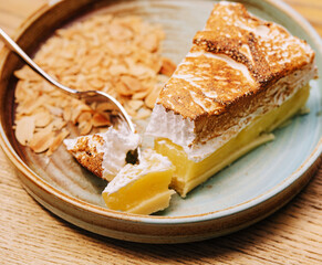 Yummy lemon meringue pie on plate