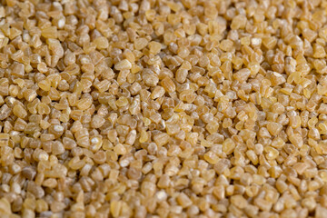 Fresh wheat porridge but cooked scattered on the table