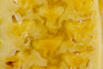 ripe pineapple of yellow-orange color cut into pieces