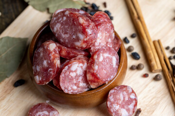 Dried pork sausage during slicing