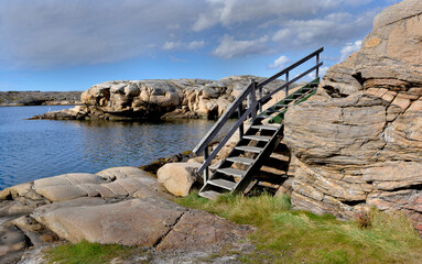 wooden stairecase  along the sea of  the Swedish rocky coast.