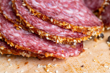 Sliced sausage with spices and lots of sesame seeds