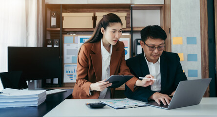 Businessman accountants work hard of annual accounting financial reports. with tax documents or work orders.