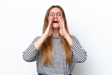 Young caucasian woman isolated on white background shouting and announcing something