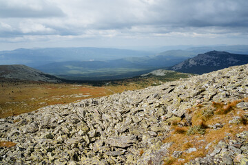 Panorama of the Ural Mountains, Russia Bashkortostan, kurum mountainside, Iremel peak, trailing in the mountains, the beauty of nature in autumn, the valley of the mountain range.