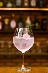 Fresh lemonade cocktail with crushed ice,   and divers oranges. Summer cold drink. Flutes of pink rose champagne garnished with red raspberries and green thyme make for a festive cocktail gathering.