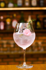 Fresh lemonade cocktail with crushed ice,   and divers oranges. Summer cold drink. Flutes of pink rose champagne garnished with red raspberries and green thyme make for a festive cocktail gathering.