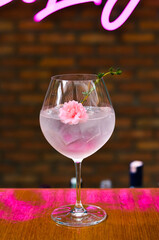 Fresh lemonade cocktail with crushed ice,   and divers oranges. Summer cold drink. Flutes of pink rose champagne garnished with red raspberries and green thyme make for a festive cocktail gathering.
