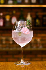 Fresh lemonade cocktail with crushed ice,   and divers oranges. Summer cold drink. Flutes of pink rose champagne garnished with red raspberries and green thyme make for a festive cocktail gathering.