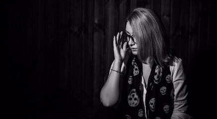 Woman in white shirt and scarf with a skull, fashionable trend for young people, new collection