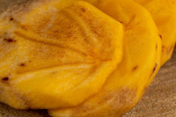 Half-ripe Orange persimmon, close up
