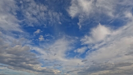 cloudiness rare beautiful white cumulus clouds in the summertime sky - photo of nature