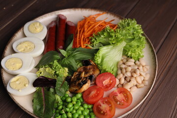 Breakfast salad desserts potato eggs bbq with beer in plate on background 