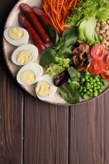 Breakfast salad desserts potato eggs bbq with beer in plate on background 