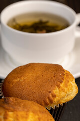 Soft and fresh fragrant wheat cupcake on a black stone