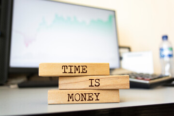Wooden blocks with words 'Time is money'. Business concept