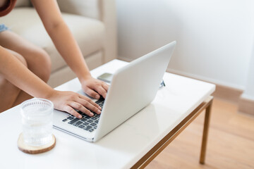 Naklejka premium Close up Woman typing laptop at home. .