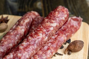 Dried veal sausage during slicing