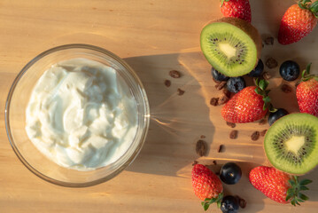 Homemade baked granola berry fruit yogurt