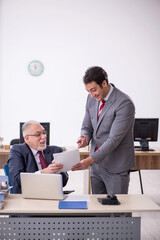 Two male colleagues working in the office