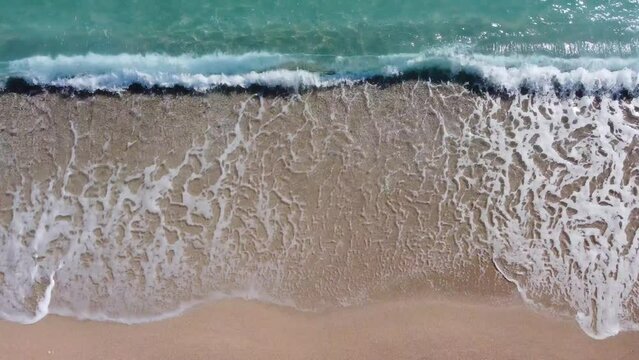 sea waves on the ocean shore by flying a drone