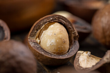 Unpeeled macadamia nuts on the table