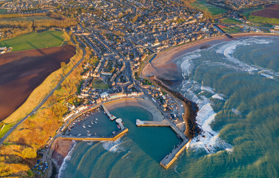 Stonehaven harbour and town at sunrise during the summer