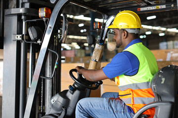 Warehouse workers or forklift driver man with hardhats and reflective jackets in vehicle using walkie talkie radio controlling stock and inventory in retail warehouse logistics, distribution center