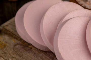 delicious fresh boiled sausage on a cutting board