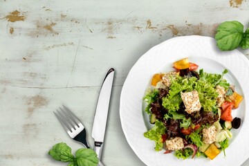 Tasty fresh salad dish on the desk