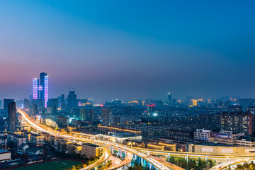 Night view of Saihong Bridge and city skyline in Nanjing, Jiangsu, China