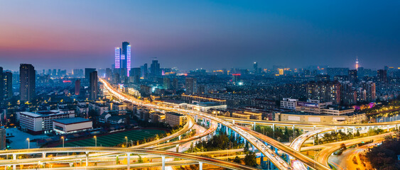Night view of Saihong Bridge and city skyline in Nanjing, Jiangsu, China © Govan