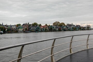 Fototapeta na wymiar Windmills and wooden houses in the Zaanse Schans, Zaanstad, Netherlands.