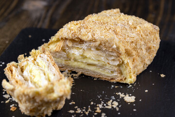 delicious piece of cake with puff pastry and sweet cream