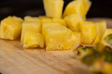 Sliced into pieces of fresh ripe peeled pineapple