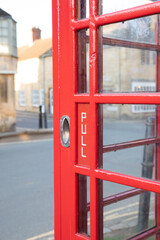 Fototapeta na wymiar The old red telephone box in Chipping Campden